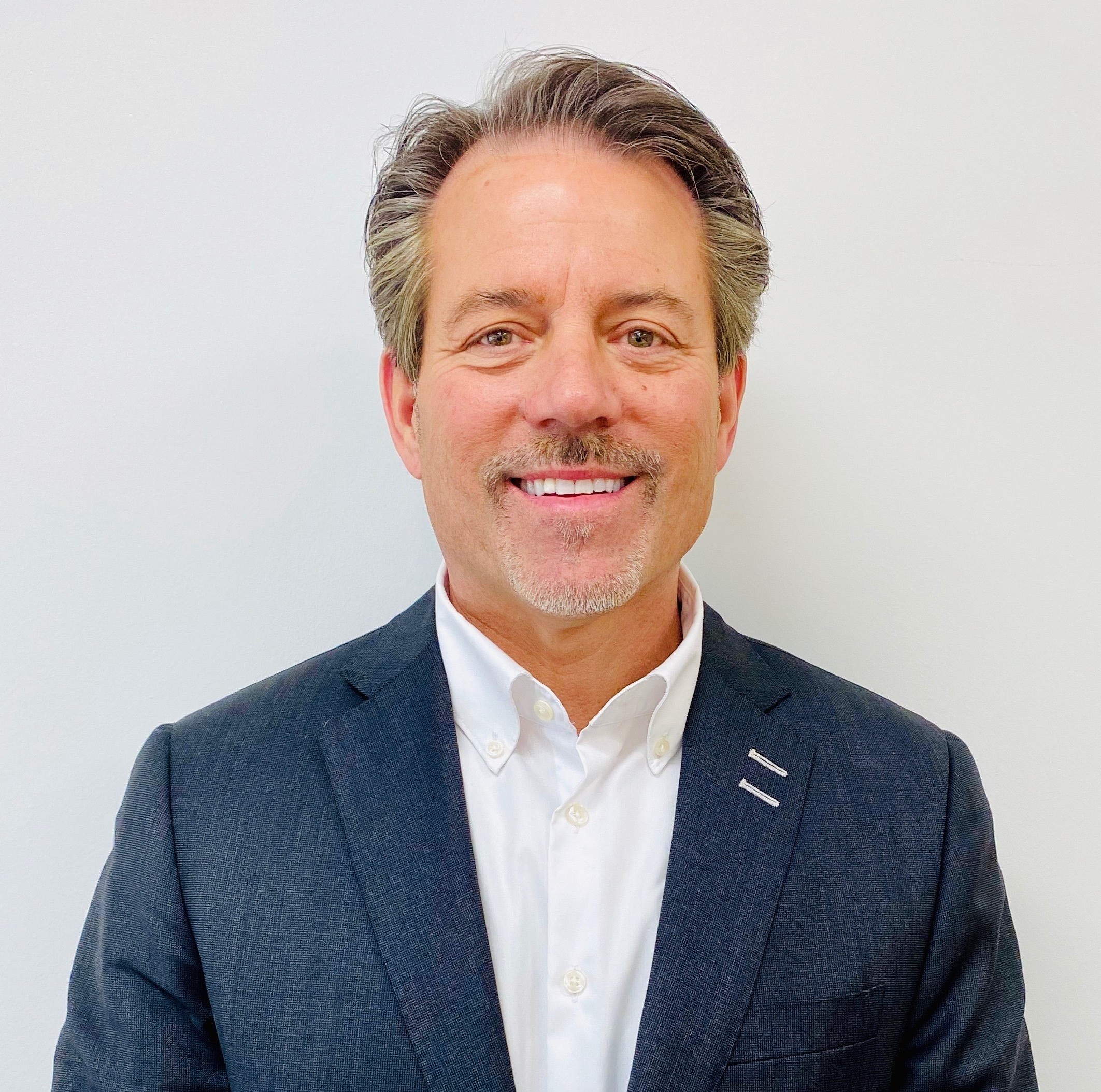 Bill O'Hara, Vice President and General Manager at Mercedes-Benz of Hoffman Estates, poses in front of the dealership. His leadership drives exceptional customer service and operations at this Mercedes-Benz location in Hoffman Estates.