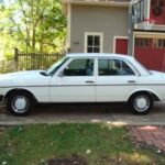 Front view of a white 1983 Mercedes-Benz 240D, highlighting its classic W123 body style.