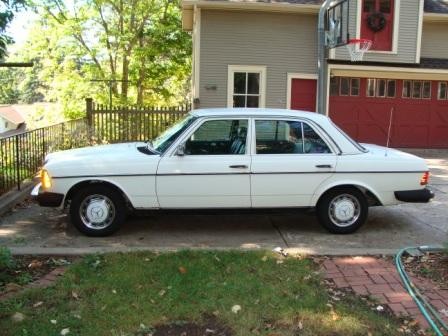 Front view of a white 1983 Mercedes-Benz 240D, highlighting its classic W123 body style.