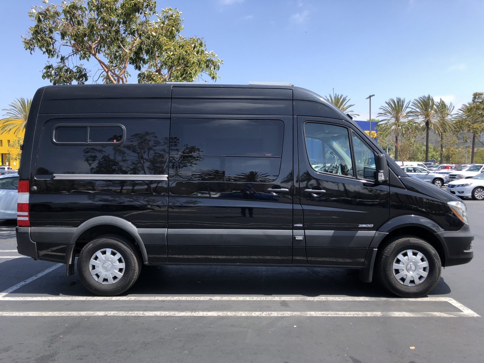 The author's Mercedes Sprinter van before undergoing custom camper conversion and upgrades, pictured shortly after purchase.