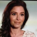 Mercedes Mason nude makeup look on Talking Dead, featuring peach nude lipstick and flattering brown eyeliner for brunettes