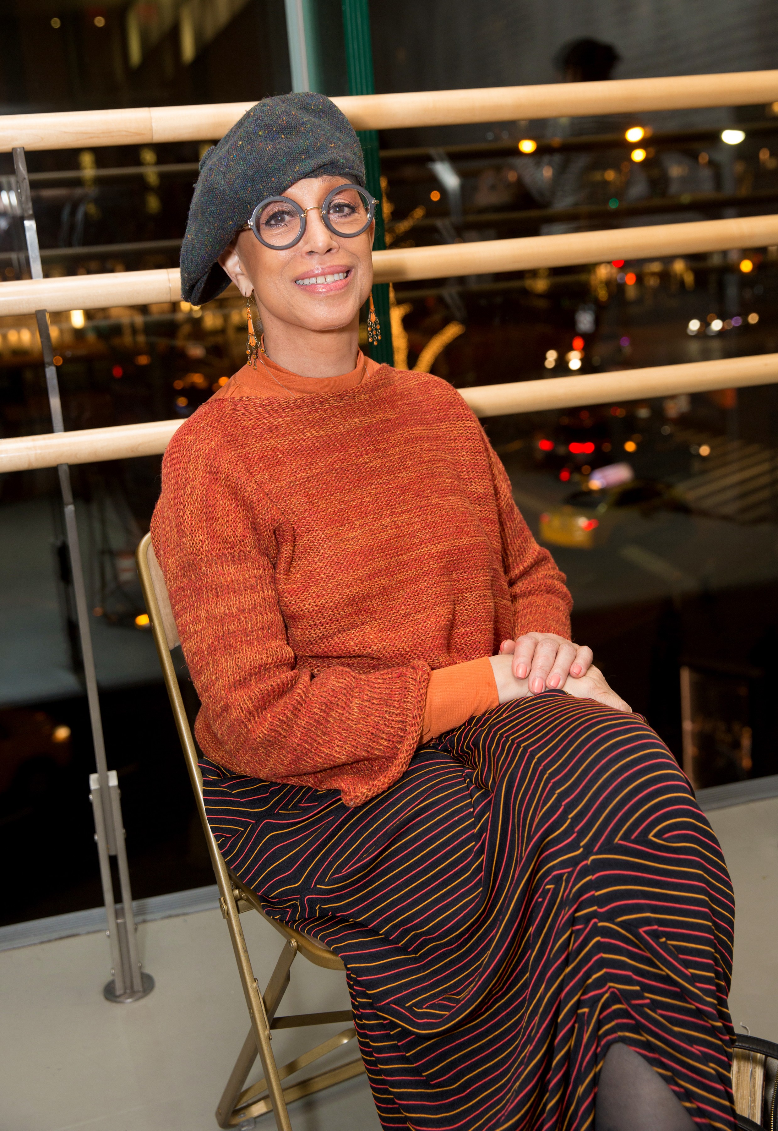 Mercedes Ellington smiling in a folding chair at Juilliard, showcasing her enduring connection to the prestigious performing arts school.