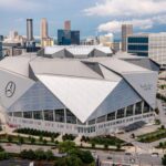 Mercedes-Benz Stadium interior showcasing seating and halo board